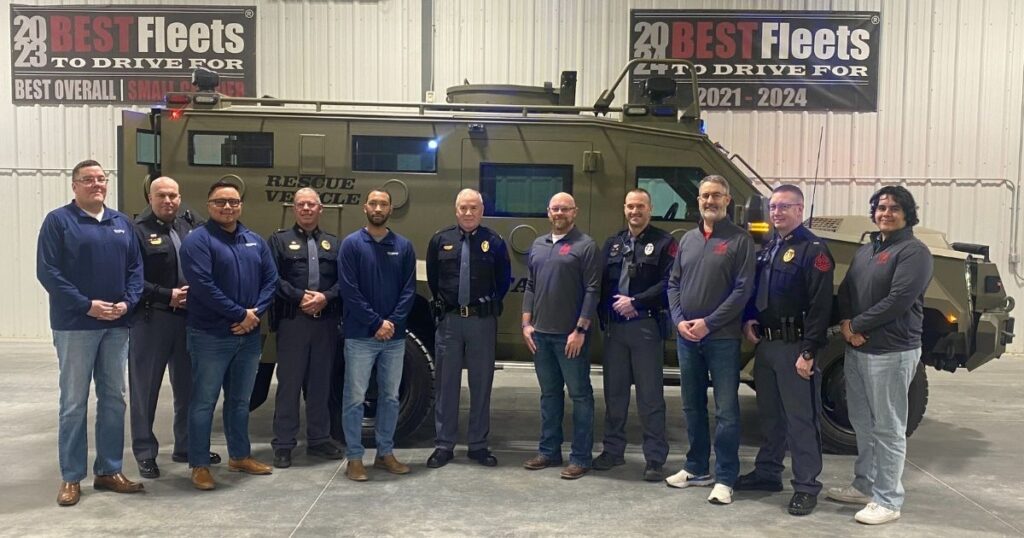 Personnel from Chief Logistics, Chief Carriers, and the Nebraska State Patrol in front of a BearCats vehicle