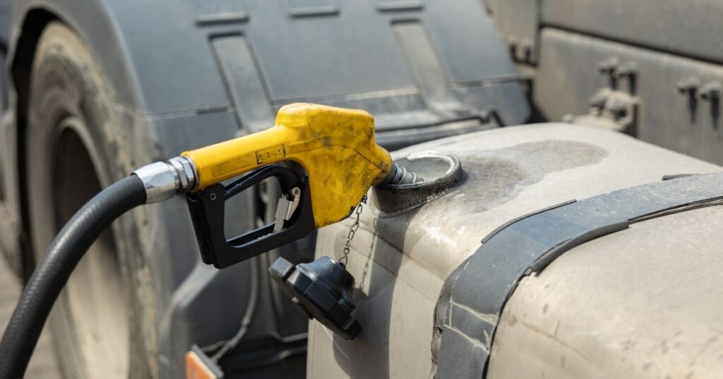 A diesel fuel nozzle filling a tank